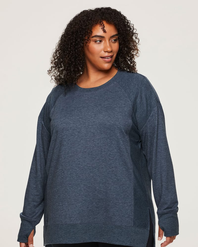 Front of a model wearing a size 1X Surrey Pullover in Teal by RBX Active. | dia_product_style_image_id:244918